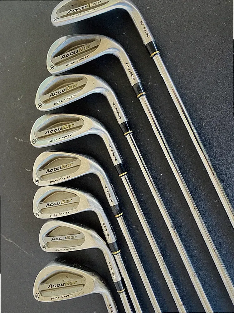 These are Ram Accubar dual cavity iron golf clubs.