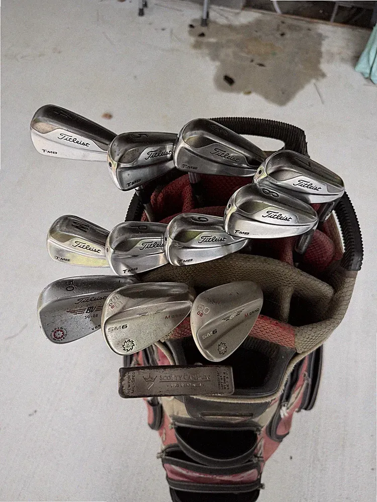 Titleist iron/wedge set with Scotty Cameron putter, M4 Driver, and cart bag