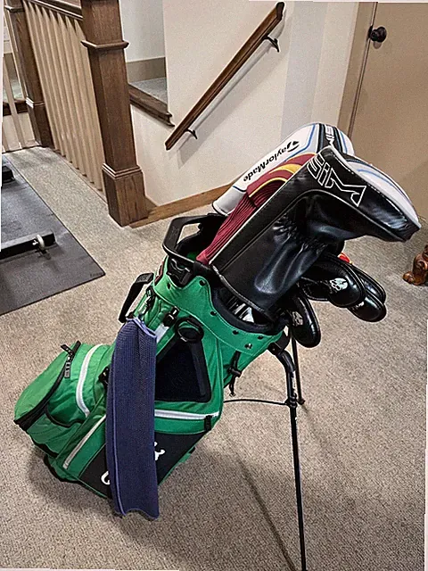Titleist T100s iron set, Taylor Made SIM woods set and Scotty Cameron Putter